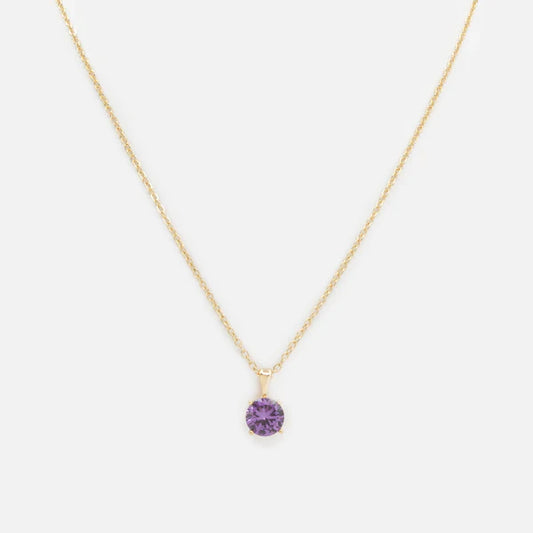 Collier doré breloque pierre mauve