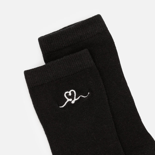 Bas noir avec broderie cœur blanc